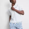 Camisas com gola reversível bordada com peixe