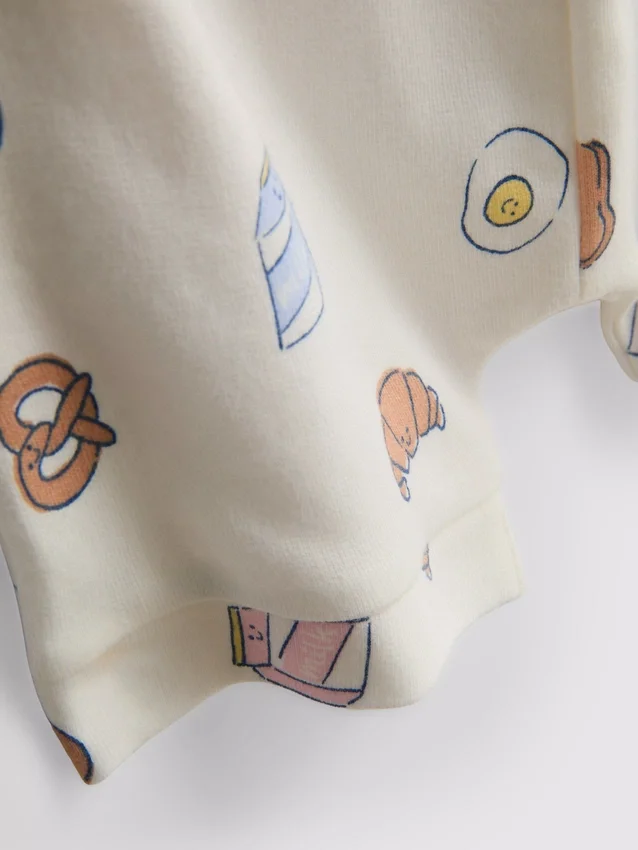 0-18 meses | Conjunto de camisola e calções com padrão de comida