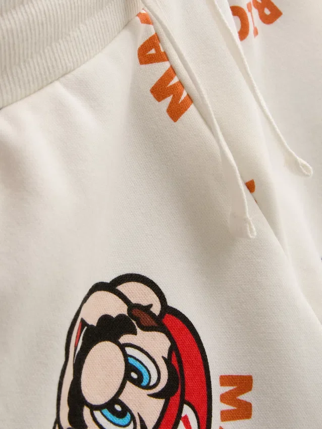 1,5-8 anos | Conjunto de camisola e calças de fato de treino «Super Mario World»