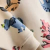 1,5-8 anos | Conjunto de camisola e calças de treino com estampado de dinossauros