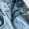 1,5-8 anos | Jeans com bordados de frutas