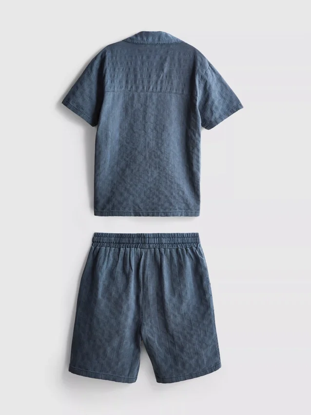7-15 anos | Conjunto de camisa de manga curta com botões e calções em tecido texturado