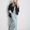 7-15 anos | Jeans de perna larga com fenda na bainha