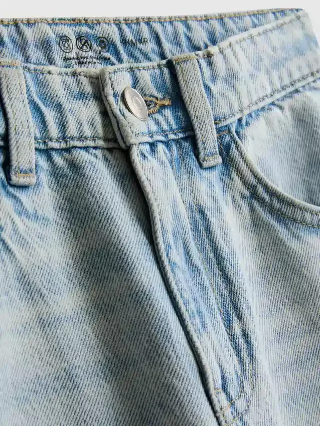 7-15 anos | Jeans de perna larga com fenda na bainha