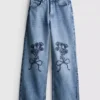 7-15 anos | Jeans de perna larga com laço floral bordado