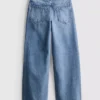 7-15 anos | Jeans de perna larga com laço floral bordado