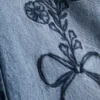 7-15 anos | Jeans de perna larga com laço floral bordado