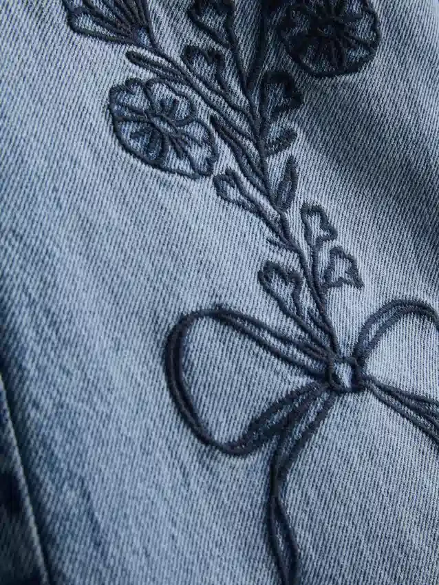 7-15 anos | Jeans de perna larga com laço floral bordado