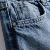 7-15 anos | Jeans de perna larga com laço floral bordado