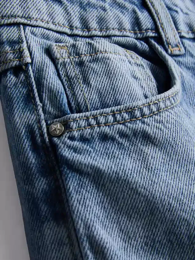 7-15 anos | Jeans de perna larga com laço floral bordado
