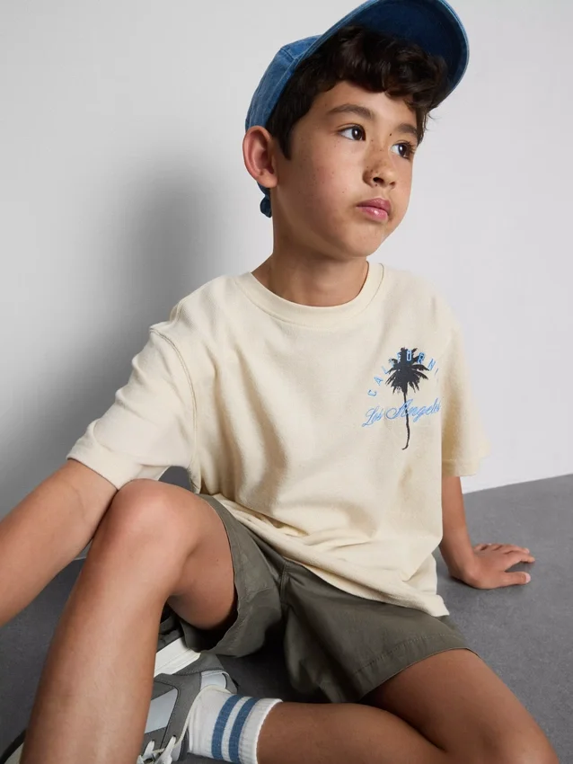 7-15 anos | T-shirt texturada com padrão de palmeiras