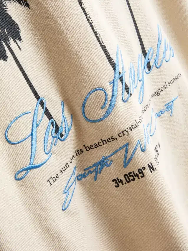 7-15 anos | T-shirt texturada com padrão de palmeiras
