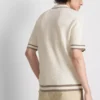 A camisa polo com fecho texturizada da The Edit