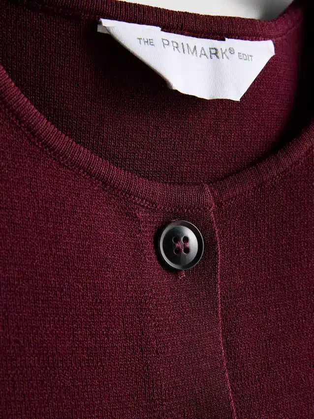A camisola sem mangas de malha com botões da coleção «The Edit»