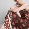A saia midi estampada em mistura de linho da The Edit