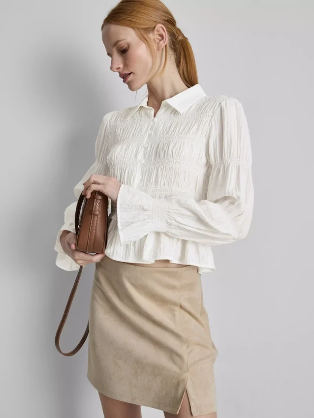 Blusa com bainha peplum franzida