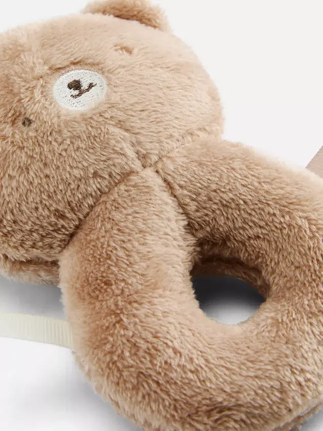 Brinquedo de peluche em forma de urso