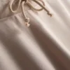 Calças de fato de treino justas com bainha