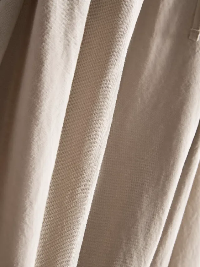 Calças de perna larga com textura