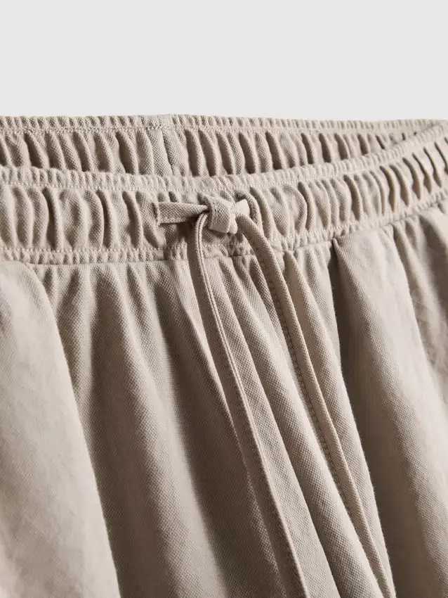 Calças de perna larga com textura
