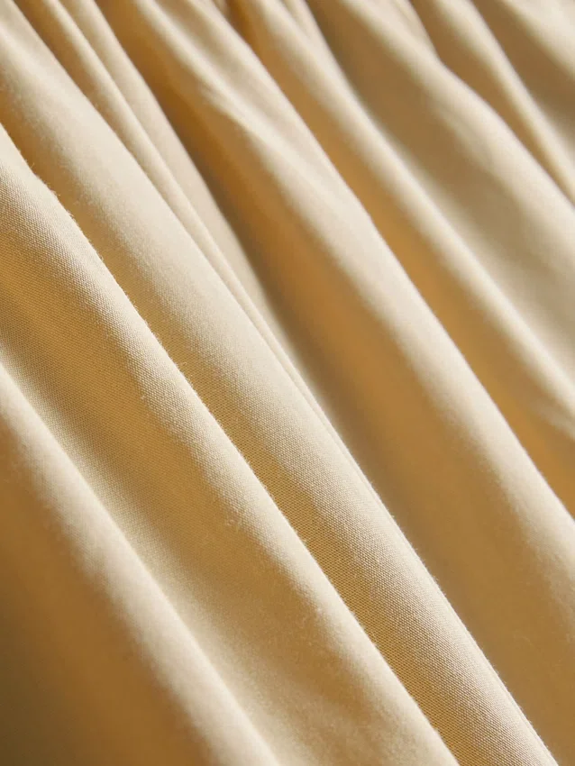 Calças de perna larga plissadas com toque de papel