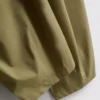 Calças de perna larga plissadas com toque de papel