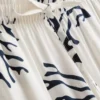 Calças de pijama de perna larga com estampado em tons de coral
