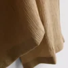 Calças largas com efeito enrugado