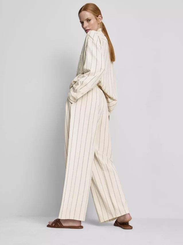 Calças largas às riscas em mistura de algodão
