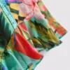 Calções com folhos e estampado tropical