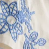 Calções de algodão com bordado floral