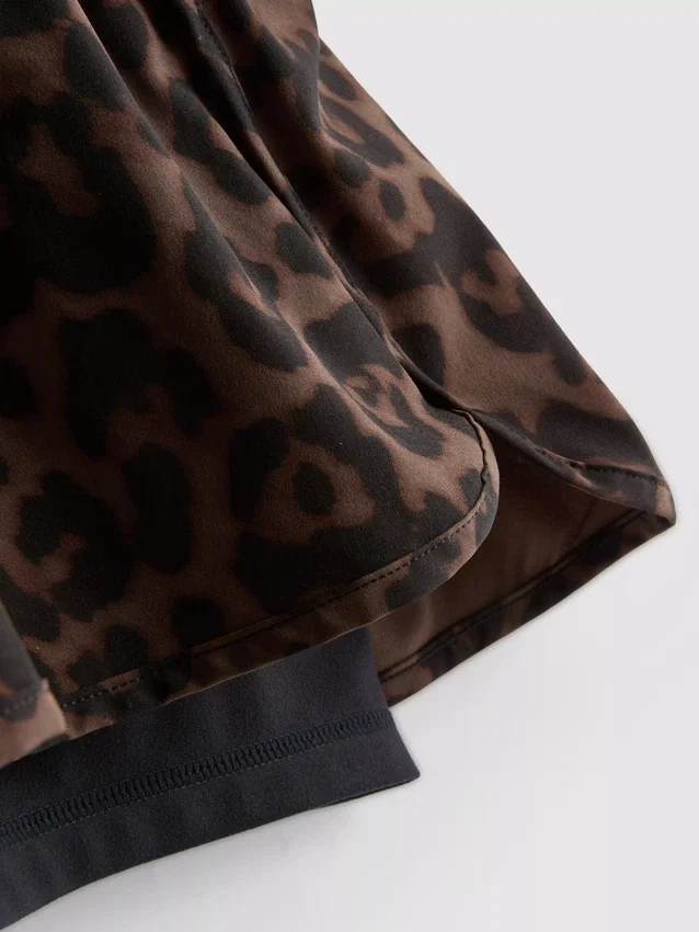 Calções de corrida com padrão de leopardo
