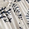 Calções de pijama estampados em tom de coral