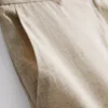 Calções plissados em mistura de linho