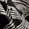 Calção de manga curta com padrão abstrato de folhas
