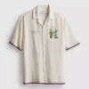Camisa com gola revere e estampado paisagístico