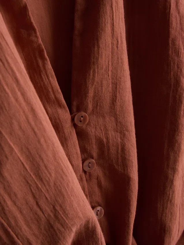 Camisa curta de algodão com laço à frente