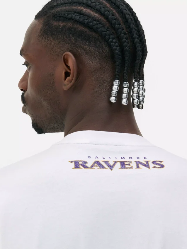 Camisas com logótipo dos Baltimore Ravens da NFL