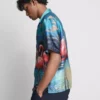 Camisas de manga curta com botões e estampadas com flamingos