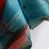 Camisas de manga curta com botões e estampadas com flamingos