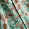 Camisas de manga curta com botões e estampadas com pássaros