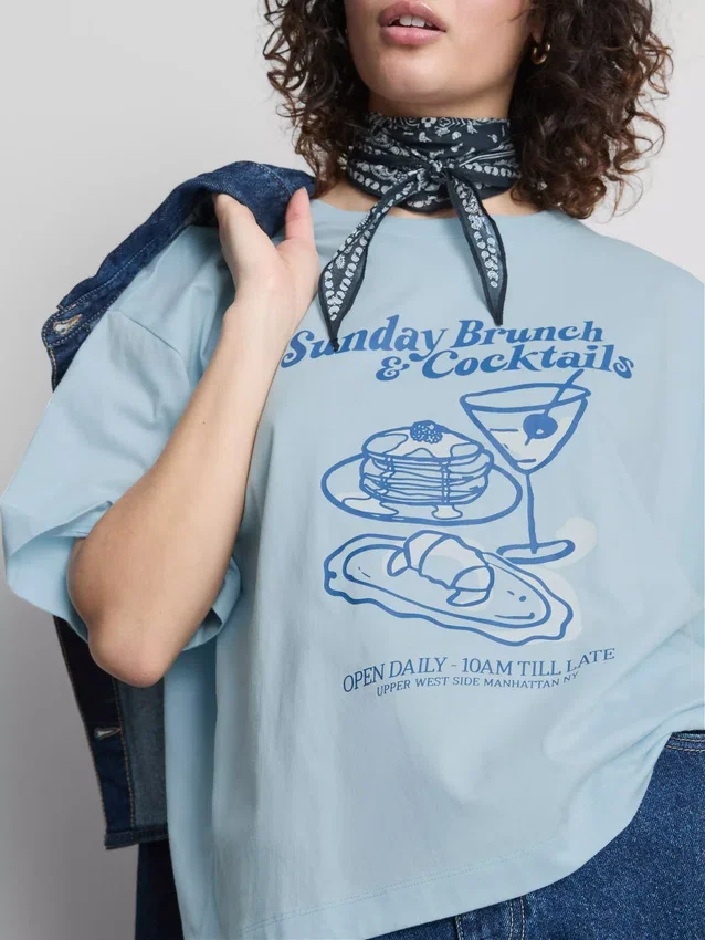 Camiseta gráfica de algodão com corte largo