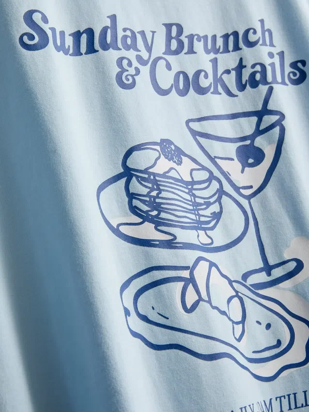 Camiseta gráfica de algodão com corte largo