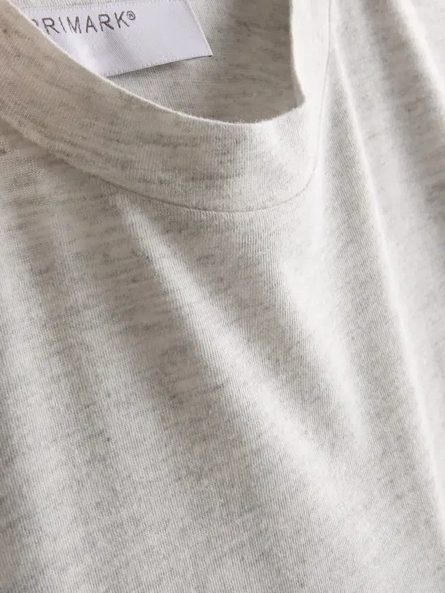 Camisola comprida com bolso de remendo