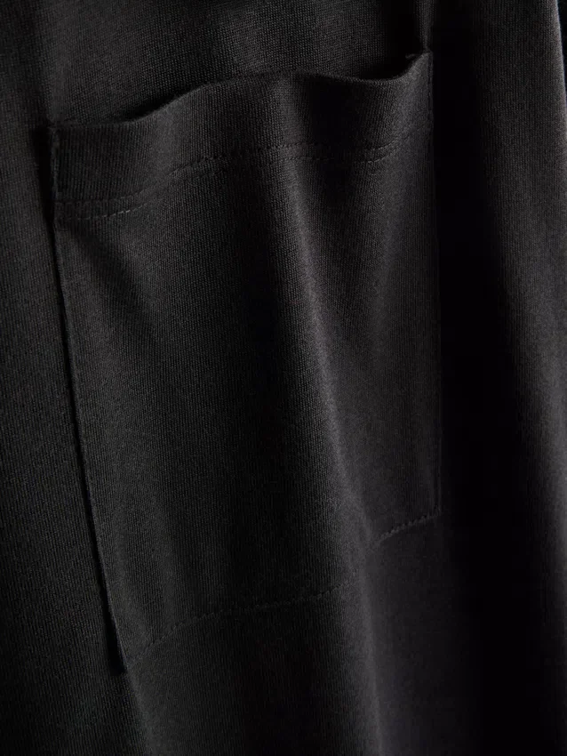 Camisola comprida com bolso de remendo