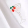 Camisola curta com contas, rica em algodão