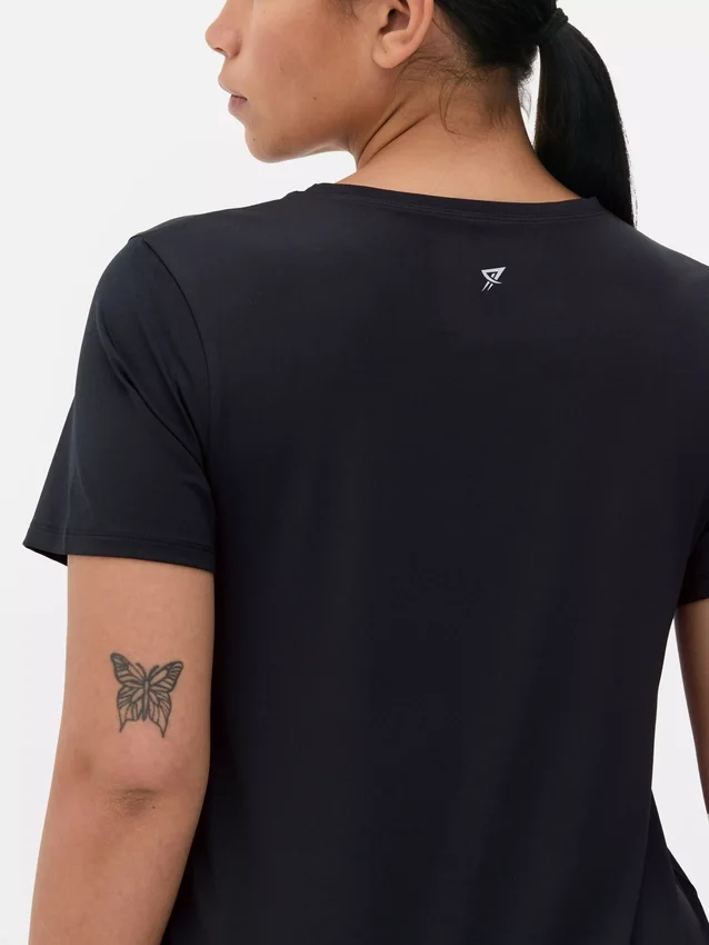 Camisola de desempenho com bainha curva