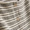 Camisola de malha às riscas com botões da Paula Echevarría