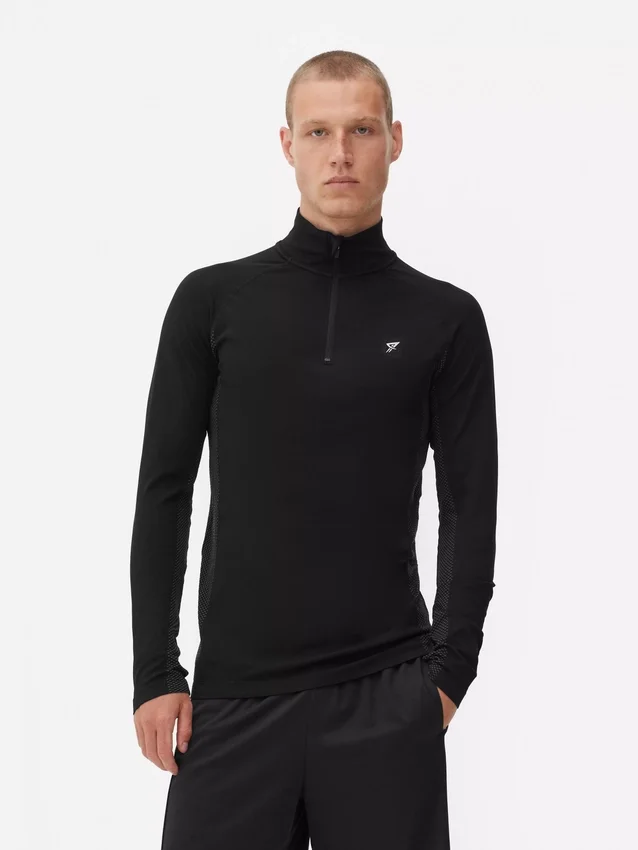 Camisola de treino de manga comprida com fecho de correr até um quarto