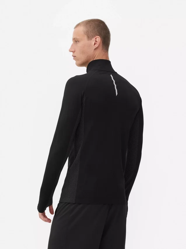 Camisola de treino de manga comprida com fecho de correr até um quarto